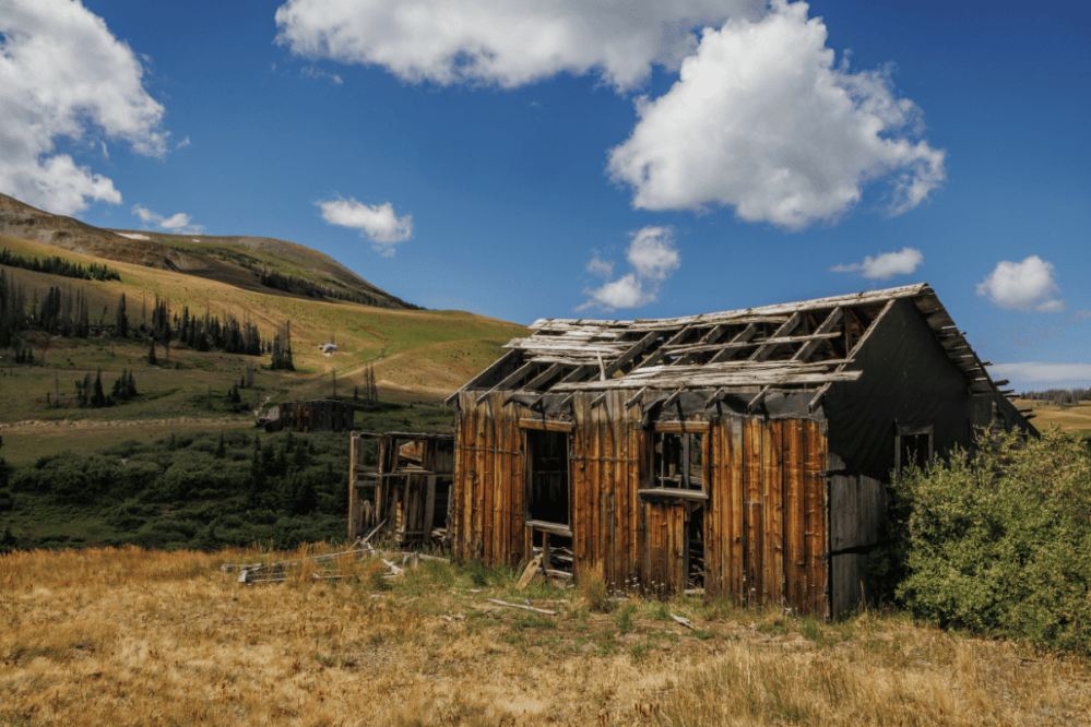 an old barn in a field