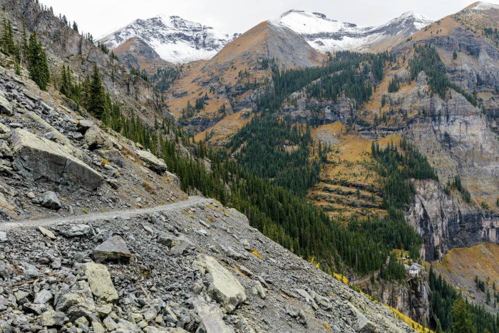 a mountain pass with snow at its peaks